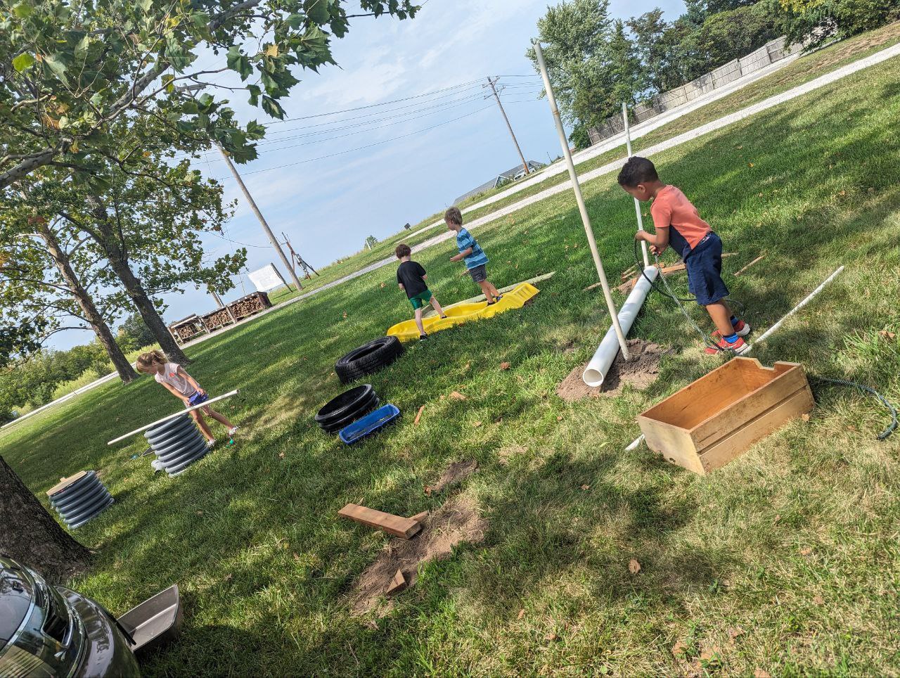 Children building and playing with equipment